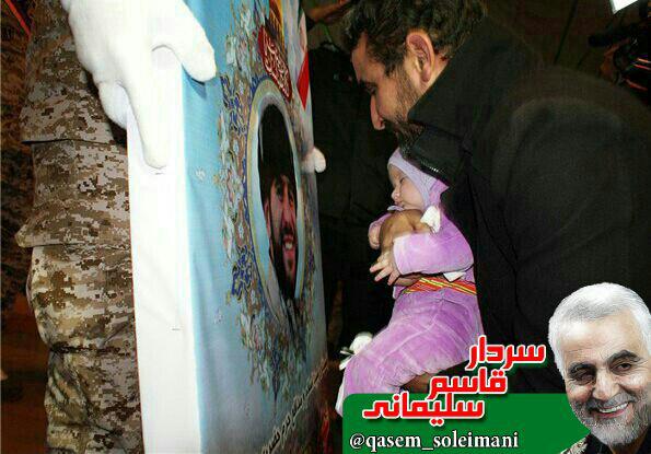 وداع دختر 3 ماه با عکس پدر شهیدش روح الله طالبی